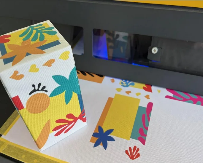 Cardboard & Paper — Decoration is printed, or applied as transfers for metallic text.