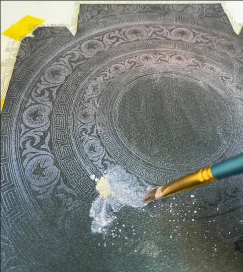 Cardboard & Paper — Decoration is printed, or applied as transfers for metallic text.